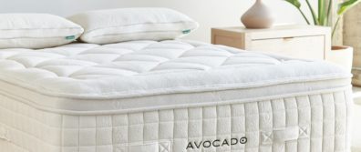 Avocado 100% organic Plush latex hybrid mattress laying on a wooden Malibu platform bedframe with organic latex pillows in a master bedroom.