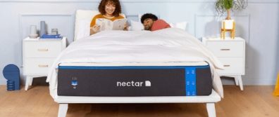 The Nectar Original mattress on a wood platform bedframe in a master bedroom with a couple laying on it. The Nectar is one of the most comfortable all foam mattresses at this price range.