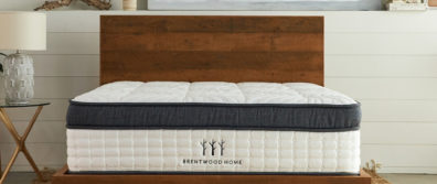 Brentwood Home Oceano Mattress laying on a dark wood platform bedframe in a master bedroom