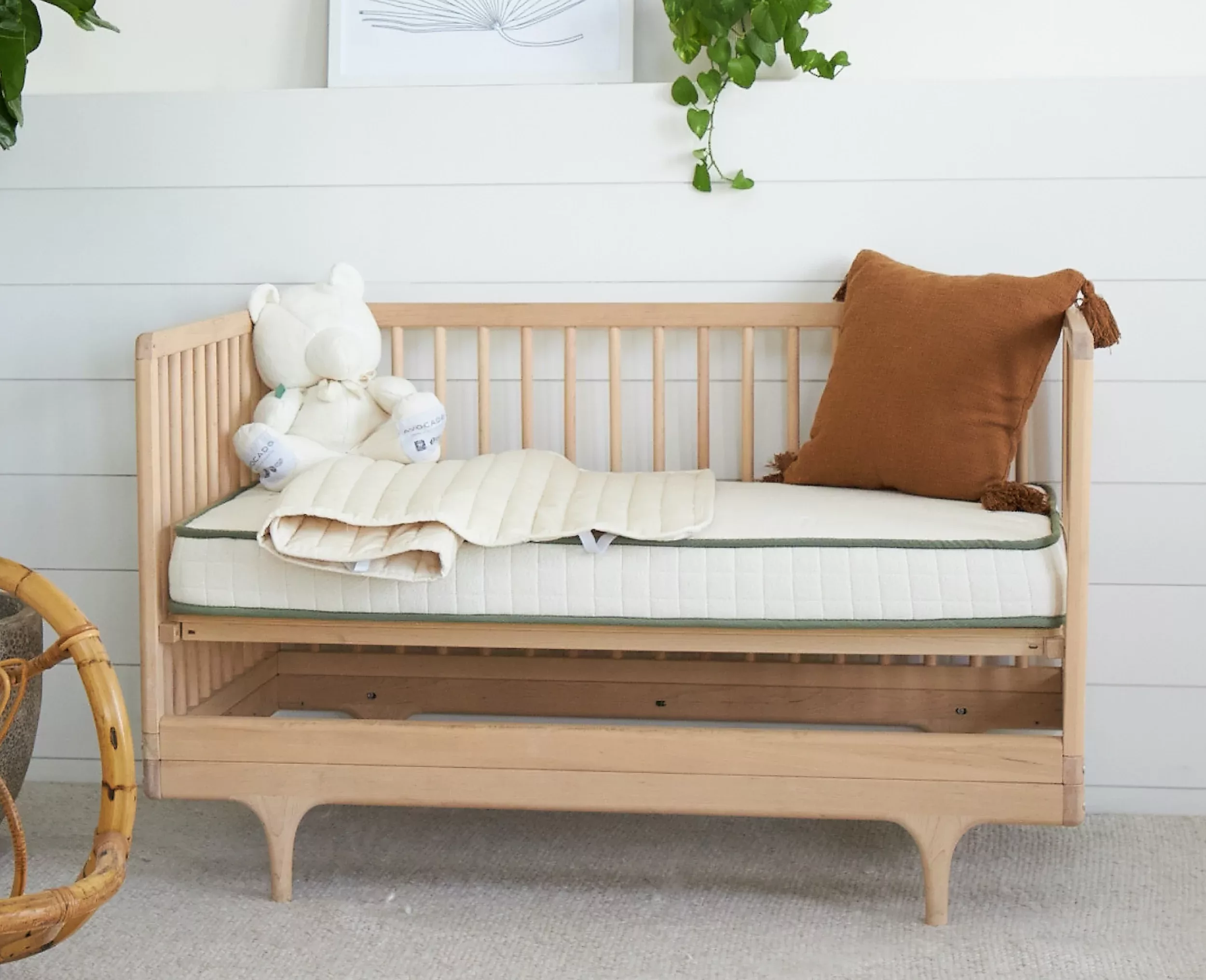 Avocado Organic Crib Mattress in a bedroom setting