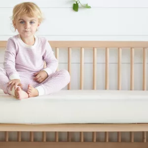 The Avocado Crib mattress with reinforced edge support